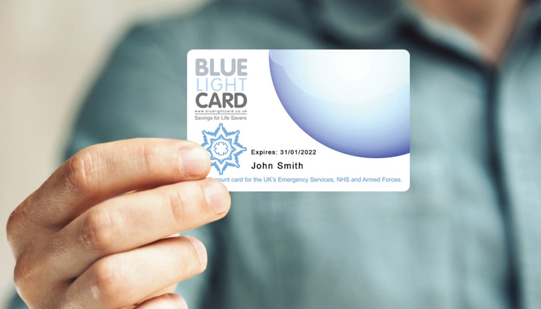 Blue Light discount card being held by a person